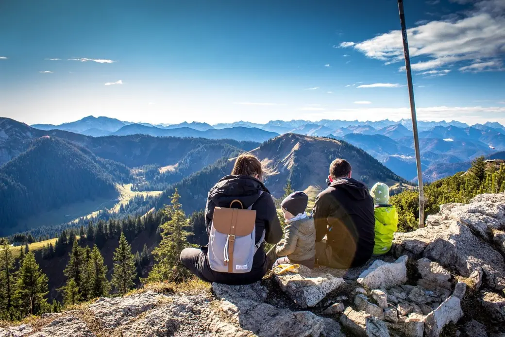 Hikers looking out over an alpine panorama